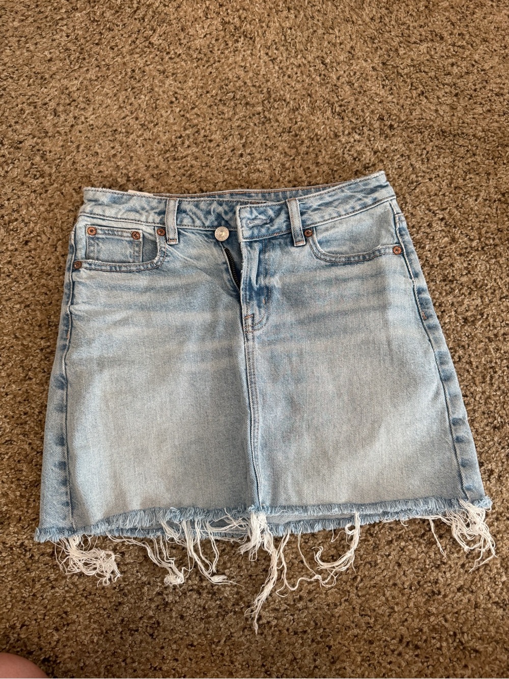 American Eagle Outfitters Light Wash Denim Mini Skirt with Frayed Hem